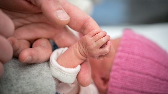 premature-newborn-baby-holding-on-to-her-grandfathers-hand-her-hand-is-so-small-and-tiny-compared-181650388-16x9_1